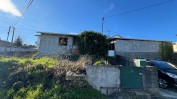 METADE INDIVISA DA PROPRIEDADE PLENA E A NUA PROPRIEDADE DA METADE DA CASA DE RÉS-DO-CHÃO E ANDAR COM QUINTAL